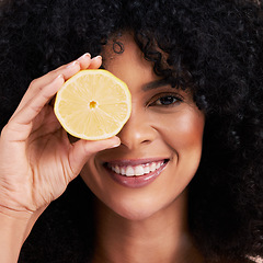 Image showing Portrait face, hair care and black woman with lemon in studio isolated on a brown background. Fruit, skincare and happy female model with lemons for healthy diet, nutrition or vitamin c and minerals.