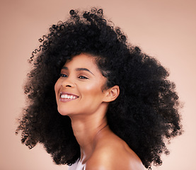 Image showing Black woman, afro hair or skincare glow on studio background in empowerment pride, curly texture or healthy growth. Beauty model, happy or natural hairstyle and makeup aesthetic on isolated spa wall