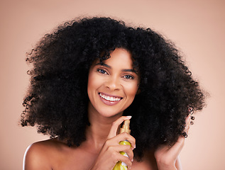 Image showing Black woman, portrait or afro hair product on isolated studio background in frizz control, curly management or oil treatment. Happy beauty model, natural or haircare spray in texture health grooming