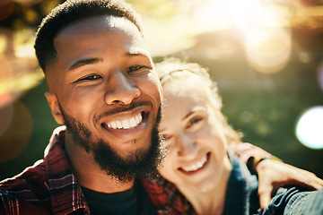 Image showing Couple, love selfie and portrait smile at park outdoors, enjoying fun time and bonding together. Diversity, romance and face of black man and woman taking pictures for happy memory or social media.