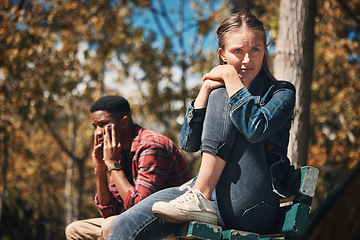 Image showing Hiking, conflict and couple argue in a forest, annoyed and sad while sitting, lost and unhappy. Sad, woman and man arguing while hiking in nature, upset and angry, disappointment and breakup, trouble