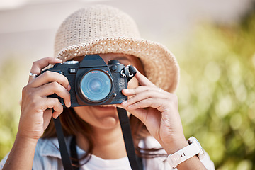 Image showing Woman, hands and camera lens in photography for nature travel, adventure or sightseeing scenery. Female photographer in focus taking photo or picture for memory, destination or location outdoors