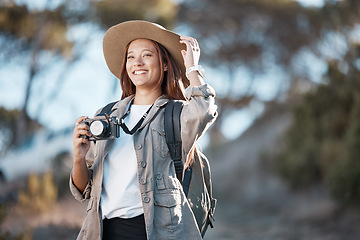 Image showing Woman, tourist and photographer with camera in hiking, adventure or backpacking journey for sightseeing in nature. Female hiker in travel photography for memory or explore mountain trekking scenery