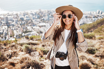 Image showing Portrait, travel and woman photographer hiking in nature, happy and relax on adventure on cityscape. Face, photography and girl student backpacking, sightseeing and on a solo trip in South Africa