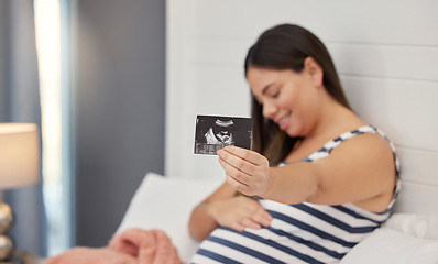 Image showing Pregnant, woman and ultrasound in hand for baby development or growth. Happy person show baby scan photograph for gynecology, pregnancy update and health or wellness with sonogram in home bedroom