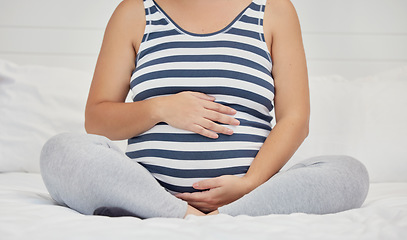 Image showing Pregnant, hands on stomach and woman in bed holding abdomen for baby, infant and child affection. Pregnancy love, family home and excited, loving and happy mother rest, relaxing and calm in bedroom