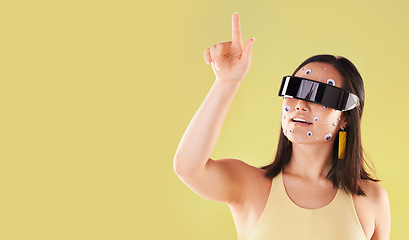 Image showing Virtual reality, 3d metaverse and woman in vr, click in cyber world or futuristic tech. Mockup, face stickers and happy female with digital headset for gaming in studio isolated on yellow background.
