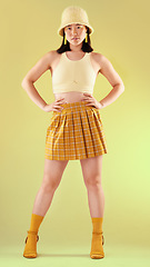 Image showing Fashion, gen z and Asian woman in yellow, beauty and streetwear with style on studio background. Trendy, bright aesthetic with model and funky designer brand clothes, stylish female in portrait