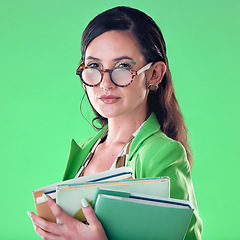 Image showing Beauty, books and portrait of a woman in studio with glasses for teaching or education. Fashion, serious and female teacher with spectacles carrying textbooks for class isolated by green background.