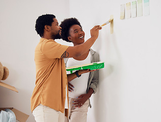 Image showing Painting, wall or home with a black couple in DIY, renovation or house remodel together with a paintbrush. Teamwork, partners or African man with happy pregnant woman excited about baby or new family