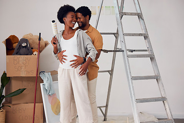 Image showing Love, pregnancy or black couple hugging in home renovation, diy or house remodel together by apartment ladder. Forehead, partnership or African man with pregnant woman excited about baby or family