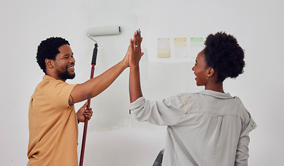 Image showing Painting, success or black couple high five in DIY, home renovation or house remodel together with a paintbrush. Happy smile, woman and fun African man with teamwork or support for decoration designs