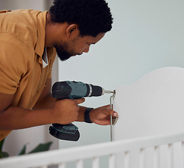 Image showing Installation, drill and man building a crib while preparing for his new baby in the family home. Engineering, metal and African father doing maintenance or repairs on the bed in nursery at his house.