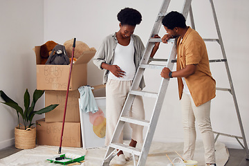 Image showing Ladder, pregnancy or black couple in home renovation, diy or house remodel together in apartment. Lovely people, helping or African man and pregnant woman excited about baby or partnership as family