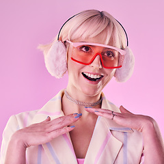 Image showing Fashion, glasses and woman with smile on pink background for beauty, vaporwave style and cosmetics. Creative aesthetic, makeup and face of girl with earmuffs, gen z clothes and cyberpunk accessory