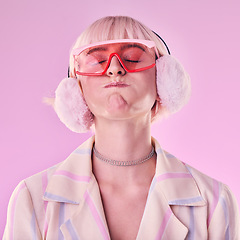 Image showing Fashion, woman and quirky on a pink background in studio with funny glasses for cyberpunk style. Face of edgy, trendy or retro aesthetic person with vaporwave, creativity and art color clothes