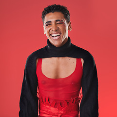 Image showing LGBTQ, fashion portrait and black man isolated on red background for creative cosmetics, makeup and queer lifestyle. Young, edgy gen z model or gay person headshot for beauty and art design in studio