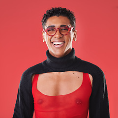 Image showing LGBTQ, queer and portrait of a gay man with unique fashion and style isolated against a studio red background. Transgender, homosexual and trendy nonbinary and gen z person happy in clothes