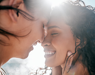 Image showing Face, love and nature with a couple together at the beach, sharing an intimate moment outdoor closeup. Trust, travel or relax with a young man and woman enjoying a romantic date bonding in summer