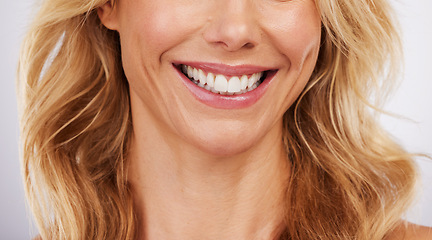 Image showing Closeup, smile and woman mouth in studio for dental, hygiene or teeth whitening on grey background. Oral, zoom and cleaning for lady satisfied with bleaching, braces or porcelain veneers results