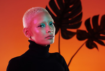 Image showing Face portrait, beauty and skincare of woman in studio isolated on red plant background. Neon aesthetic, makeup cosmetics and gen z model with glowing, healthy and flawless skin after spa treatment.