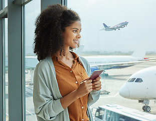 Image showing Passport, airport and woman waiting to board her flight for a business work trip in the city. Travel, terminal and African female traveler watching the planes by the window before leaving for holiday