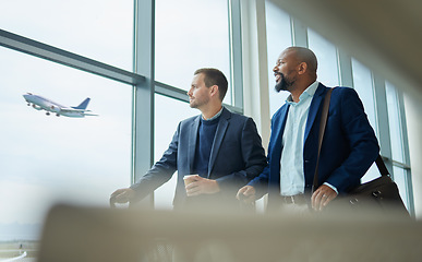 Image showing Travel for business, team of men at airport for flight, conversation with conference or seminar. Diversity, partnership and looking out of window, professional trip for architecture convention