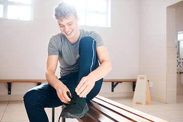 Image showing Sports, tying shoes and man in locker room for training, fitness and gym workout. Exercise, health and start cardio with athlete and dressing sneakers for cardio, wellness or ready for practice