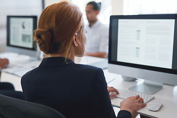 Image showing Back, business woman and computer for planning, data analysis or internet technology in office. Female worker typing on desktop monitor for seo research, website network or company strategy analytics