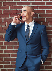 Image showing Businessman, brick wall and phone call in suit with smile for networking, contact and corporate connection. Happy worker, leader and talking on mobile for trading deal, stock sales or client feedback