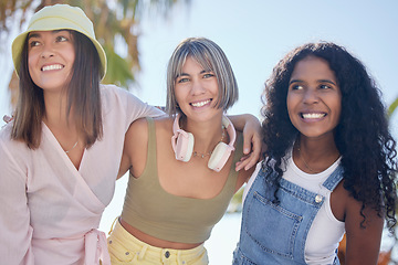 Image showing Portrait, friends and hug while at a beach walking, talking and bonding on summer holiday. Diversity, face and women embrace on walk outdoors for travel, vacation and trip in Miami together