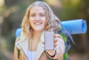 Image showing Mockup phone screen, hand or woman hiking in nature or forest with mobile app, product placement or 5g technology promotion. Travel, happy girl holding smartphone for advertising or marketing space