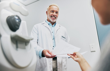 Image showing Ophthalmology, consulting and doctor with a patient for results, vision help and surgery information. Healthcare, communication and mature ophthalmologist talking to a woman about advice on eyes