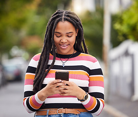 Image showing Black woman with phone in city, happy outdoor with technology, chat and communication, travel and fashion. Social media, urban street and adventure with female, connectivity and 5g in Jamaica