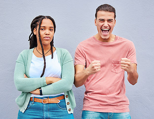 Image showing Bored, excited and portrait of an interracial couple with arms crossed, anger and happy about a win. Sad, smile and young man and woman looking angry, comic and mad about losing in a competition