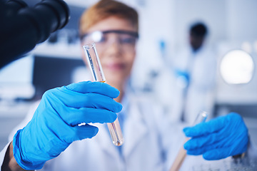 Image showing Glass vials, science and female scientist doing research, experiment or tests in a medical lab. Innovation, professional and senior woman scientific researcher working in a pharmaceutical laboratory.