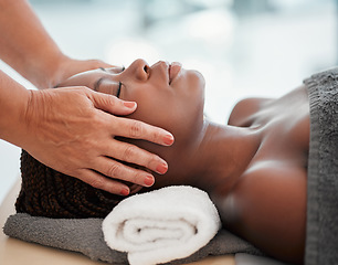 Image showing Face massage, spa and black woman with skincare wellness, peace and calm for luxury treatment. Facial therapist and hands for beauty, zen and healing, stress relief and african person relax on table