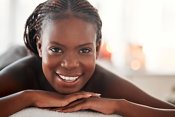 Image showing Spa, portrait and black woman with smile, massage and salon luxury treatment, bare and lying on table. Face, African American female and lady with happiness, relax and healing therapy for wellness