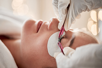 Image showing Eyelash extensions, beauty and woman getting a treatment at a salon for cosmetics or self care. Cosmetology, beautiful and young female getting a luxury cosmetic eye procedure from beautician at spa.