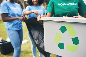 Image showing Recycle bin, volunteer group and community park cleaning outdoor for eco friendly and sustainability. Working, recycling and trash collection of young people doing green ecology and charity work