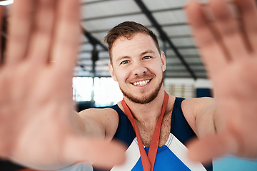 Image showing Gymnastics, sports and man athlete taking a selfie after winning a medal in a competition. Happy, smile and portrait of proud male gymnast winner taking a picture after training or practice in arena.