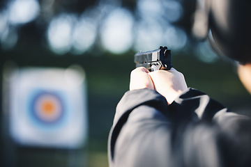 Image showing Gun, target and person training outdoor for shooting range, game exercise or sports event closeup. Hands with firearm and circle for aim, vision and practice, police learning academy or field gaming