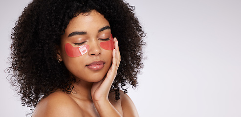 Image showing Eye mask, skincare and mockup with a model black woman in studio on a gray background for beauty or cosmetics. Spa, relax and facial with an attractive young female posing beside mock up space