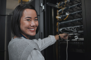 Image showing Asian woman, portrait smile and technician by server for networking, maintenance or systems at office. Happy female engineer smiling for cable service, power or administration in data center room