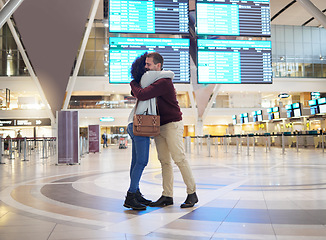 Image showing Couple, hug and goodbye at airport for travel, trip or flight in farewell for long distance relationship. Man and woman hugging before traveling, departure or immigration arrival waiting for airline