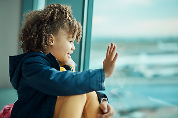 Image showing Girl child, wave and airport window for greeting, goodbye and smile for airplane, international transport and travel. Kid, happy and hand gesture by glass for global immigration, young and African
