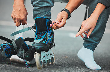 Image showing Hands tie roller skate for sports, adventure and fitness hobby in city, street and urban town. Exercise, freedom and zoom of shoes for skating, travel activity and journey on road for outdoor workout