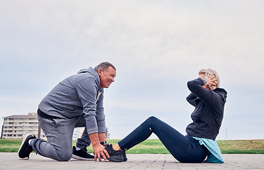 Image showing Fitness, health and sit ups with a senior couple training outdoor together for an active lifestyle of training. Workout, exercise or core with a mature man and woman outside on the promenade