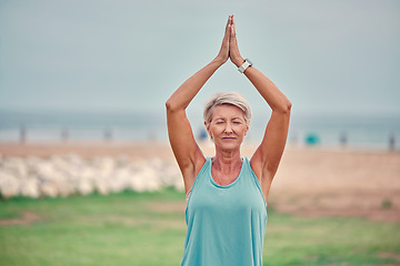 Image showing Meditation, outdoor and senior woman doing a yoga exercise for mind, body and spiritual balance. Wellness, health and calm healthy elderly lady in retirement doing a morning pilates workout in a park