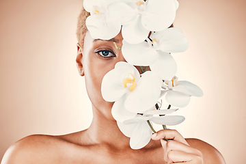 Image showing Orchid flower, skincare and black woman portrait with spa aesthetic for luxury and wellness. Beauty, studio and cosmetics of a young model with flowers for organic facial and dermatology treatment